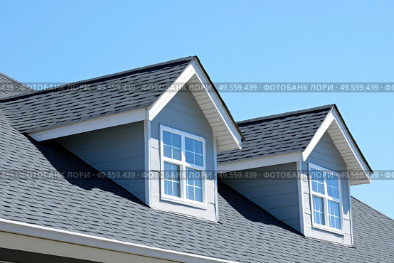 House Exterior. Roof Window. Second floor among blue sky. Mansard attic. Newly build houses. Gable roof with skylight, asphalt roofing, shingles. Residential Home. Vinyl Siding. Polymeric roof-tiles. Стоковое AI-изображение, AI-художник Марина Демидюк / Фотобанк Лори