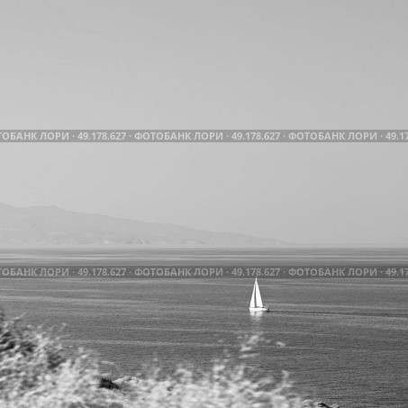 in europe greece santorini island hill and rocks on the summertime beach . Стоковое фото, агентство Ingram Publishing / Фотобанк Лори
