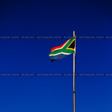 in south africa close up of the blur  national flag on pole. Стоковое фото, агентство Ingram Publishing / Фотобанк Лори