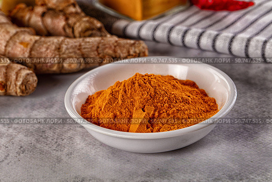 Indian tumeric cumin dry powder. Стоковое фото, фотограф Андрей Старостин / Фотобанк Лори