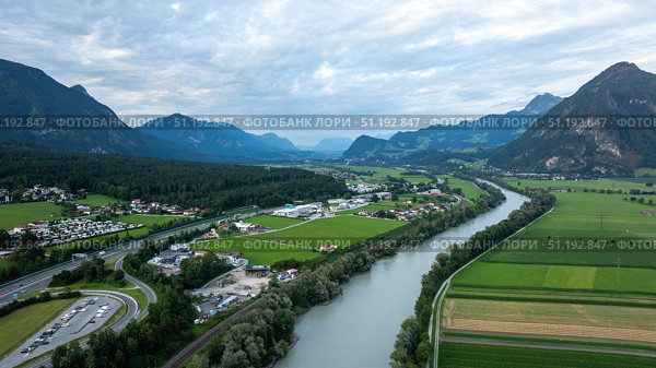 Inn river meandering through green valley in the Austrian Alps near Wiesing, Tyrol. Стоковое фото, фотограф Данил Руденко / Фотобанк Лори