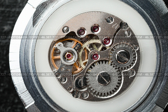 Inside view of watch mechanism, closeup. Стоковое фото, фотограф Pixel_shot / Фотобанк Лори