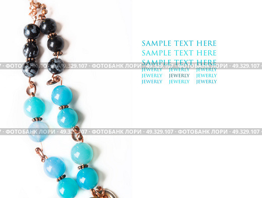 jewerly bracelet  with chalcedony and obsidian around white background. Стоковое фото, агентство Ingram Publishing / Фотобанк Лори