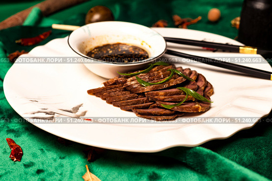Journey of Flavor a Spiced Shank Dish at a Restaurant in China. Стоковое фото, фотограф Aleksandr Golubev / Фотобанк Лори