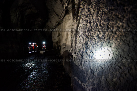 Khromtau, Aktobe region, Kazakhstan - May 06 2012: Gold mine. Miners in underground gallery. Редакционное фото, фотограф Alexey Rezvykh / Фотобанк Лори