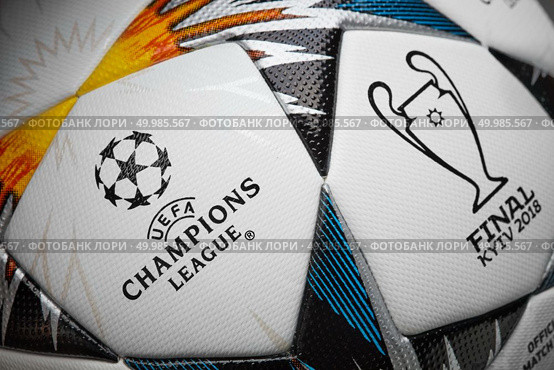 Kiev, Ukraine - February 22, 2018: The 2018 UEFA Champions League Final ball will be the final match of the 2017-18 UEFA Champions League, the 63rd season of Europe’s premier club football tournament organised by UEFA, and the 26th season since it was renamed from the European Champion Clubs’ Cup to the UEFA Champions League. It will be played at the NSC Olimpiyskiy Stadium in Kiev, Ukraine on 26 May 2018, close-up. Kiev, Ukraine - February 22, 2018: UEFA Champions League Final ball will be the final match of the 2017-18 UEFA Champions League. Редакционное фото, агентство Ingram Publishing / Фотобанк Лори