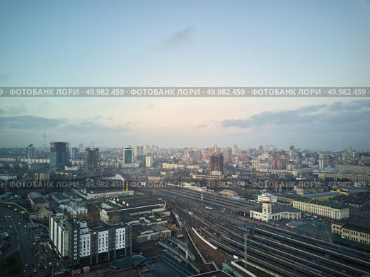 Kiev, Ukraine.- January 11,2018: View from a birdseye on the city of Kiev and the railway with trains. Aerial view of the city of Kiev. Редакционное фото, агентство Ingram Publishing / Фотобанк Лори