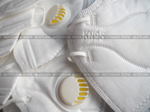 KN95 masks. Respirator, practical personal protective equipment. Several layers of the mask perfectly clean the inhaled air and effectively protect the respiratory tract from infection. Стоковое фото, фотограф Юлия Петровская / Фотобанк Лори