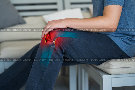 Knee pain, man suffering from osteoarthritis at home. Стоковое фото, фотограф Станислав Тарко / Фотобанк Лори