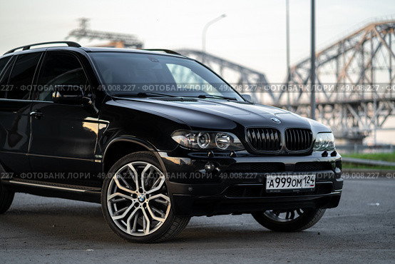 KRASNOYARSK, RUSSIA - May 23, 2025: Black BMW X5 E53. Редакционное фото, фотограф Плотников Дмитрий / Фотобанк Лори