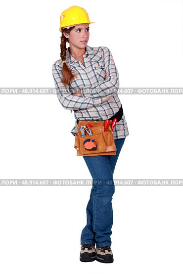 Labourer standing with her arms crossed. Стоковое фото, агентство Ingram Publishing / Фотобанк Лори