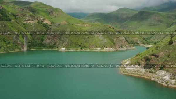 Lake Gizhgit in the Caucasus Mountains. Стоковое видео, видеограф Михаил Коханчиков / Фотобанк Лори