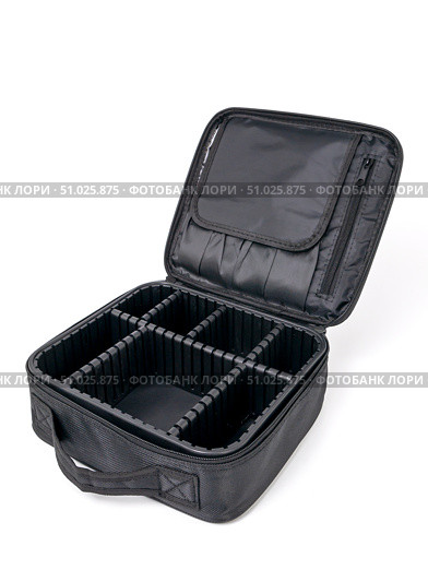 Large open empty black cosmetic suitcase with many compartments on white background. Стоковое фото, фотограф Катерина Белякина / Фотобанк Лори