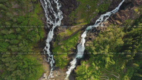 Latefossen is one of the most visited waterfalls in Norway and is located near Skare and Odda in the region Hordaland, Norway. Consists of two separate streams flowing down from the lake Lotevatnet. (2019 год). Стоковое видео, видеограф Андрей Армягов / Фотобанк Лори