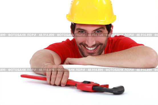 Laughing worker with a wrench. Стоковое фото, агентство Ingram Publishing / Фотобанк Лори