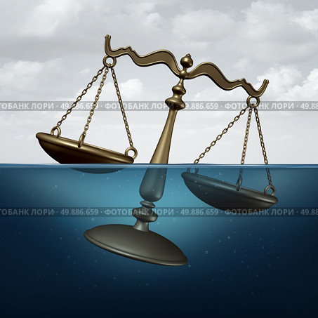 Legal trouble concept or justice problems symbol as a scale of justice drowning in water as a metaphor for law or regulation problems. Стоковое фото, агентство Ingram Publishing / Фотобанк Лори
