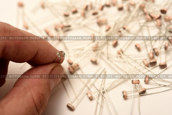 Light resistors. Photoresistors on a white background. Electronic components. Стоковое фото, фотограф Valeriy Lushchikov / Фотобанк Лори