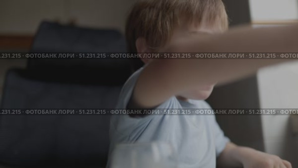 Little boy disgusted by orange juice taste. Стоковое видео, видеограф Константин Шишкин / Фотобанк Лори