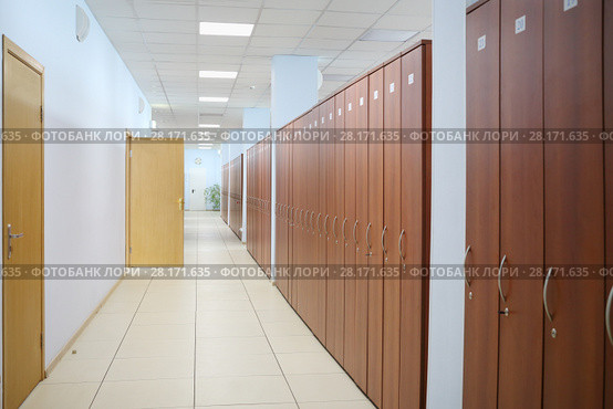 Long corridor with many wooden cabinets and opened door in office. Стоковое фото, фотограф Losevsky Pavel / Фотобанк Лори
