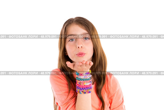 Loom rubber bands bracelets blond kid girl blowing hand on white background. Стоковое фото, агентство Ingram Publishing / Фотобанк Лори