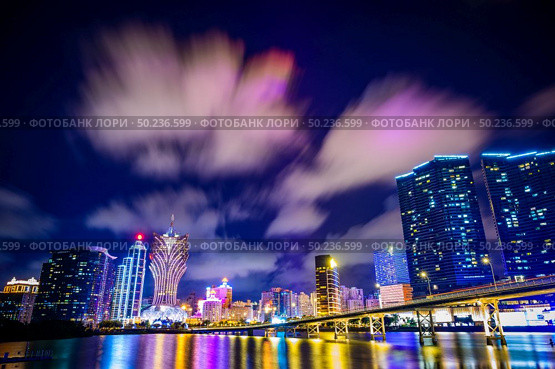 Macau cityscape at night, all hotel and tower are colorful lighten up with blue sky, Macau, China. Стоковое фото, агентство Ingram Publishing / Фотобанк Лори