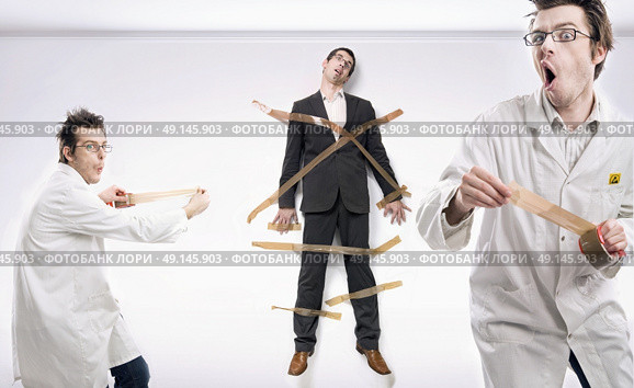 Mad scientist and rich, bound businessman. Стоковое фото, агентство Ingram Publishing / Фотобанк Лори