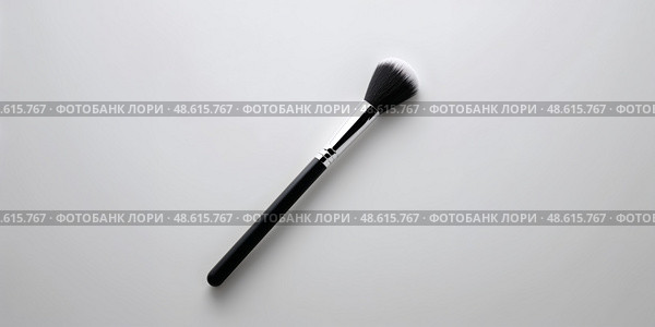 Makeup brush rests on a clean surface, highlighting its soft bristles and sleek design for beauty enthusiasts and professionals alike. Стоковое AI-изображение, AI-художник Сергей Толмачёв / Фотобанк Лори