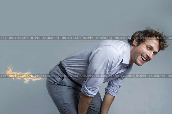 Male businessman with flames coming out of his butt. Стоковое AI-изображение, AI-художник Дмитрий Киселёв / Фотобанк Лори