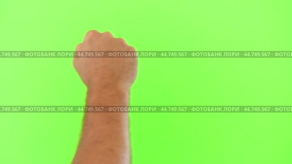 Male Hand Knocking Isolated on Chroma Key Green Screen Background. Body Language. 4K Video Footage. Close-Up. Man's Fist Making Knock Knock Gesture. Copy Space for Promotion. Greenscreen for Keying. Стоковое видео, видеограф Марина Демидюк / Фотобанк Лори