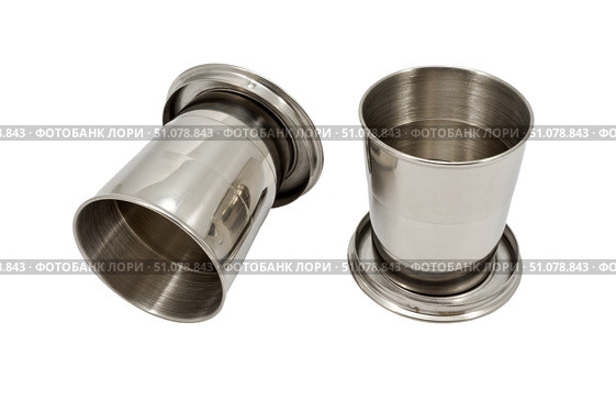 Маленькие металлические стаканчики на белом фоне. Small metal cups on a white background. Стоковое фото, фотограф Татьяна Д / Фотобанк Лори