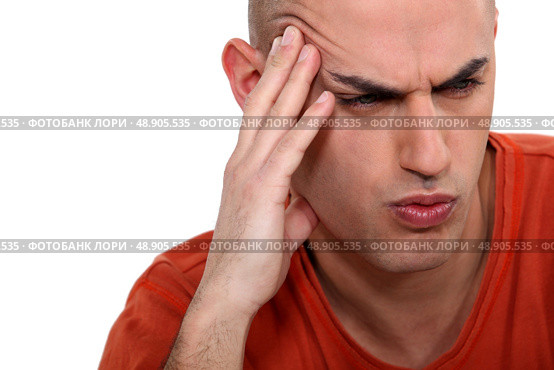 Man grimacing, white background. Стоковое фото, агентство Ingram Publishing / Фотобанк Лори