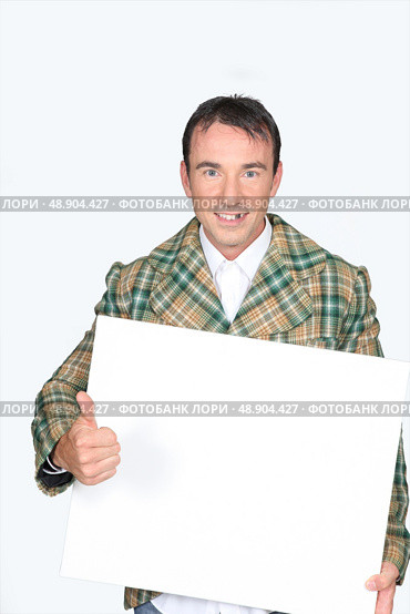 man holding a white board. Стоковое фото, агентство Ingram Publishing / Фотобанк Лори