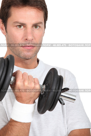 Man lifting a dumbbell. Стоковое фото, агентство Ingram Publishing / Фотобанк Лори