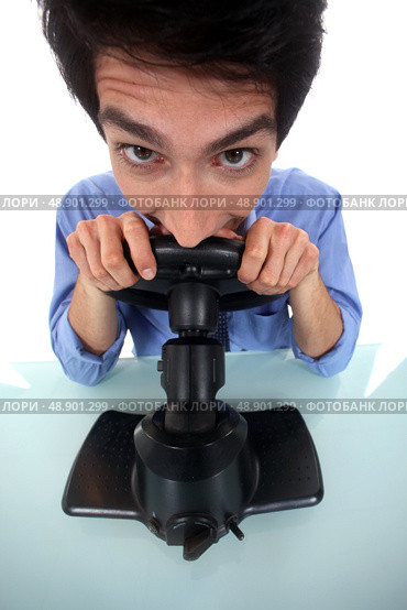 Man pretending to play a console. Стоковое фото, агентство Ingram Publishing / Фотобанк Лори
