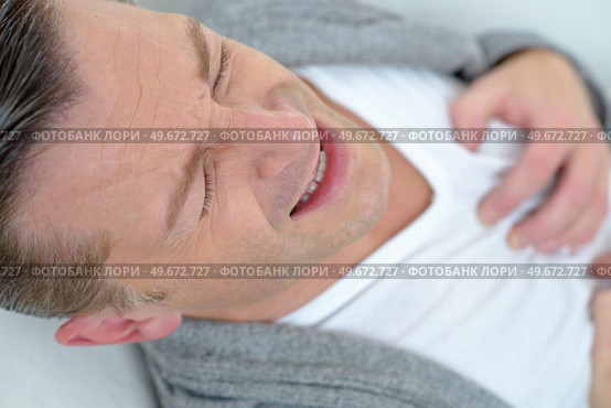 man suffering from heart ache. Стоковое фото, агентство Ingram Publishing / Фотобанк Лори
