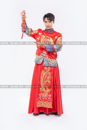 Man wear Cheongsam smile to get Firecrackers from boss in chinese new year. Стоковое фото, агентство Ingram Publishing / Фотобанк Лори