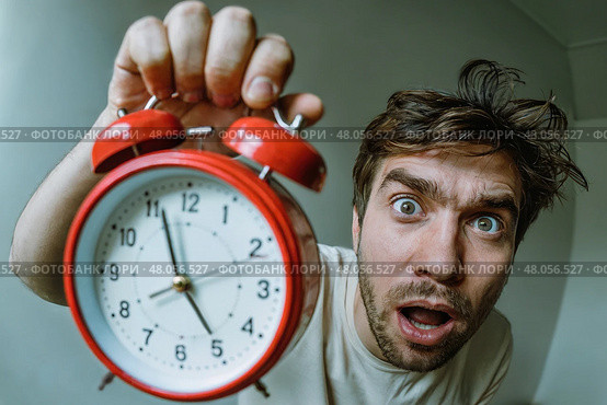 Man who just woke up with a alarm clock in his hand. Стоковое AI-изображение, AI-художник Дмитрий Киселёв / Фотобанк Лори