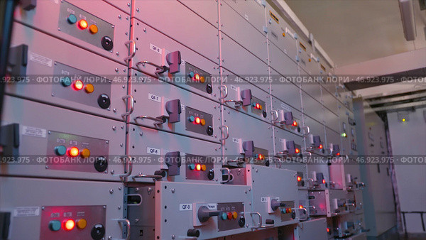 Many buttons light up on control panels in electrical industry. Стоковое фото, фотограф David Kashakhi / Фотобанк Лори