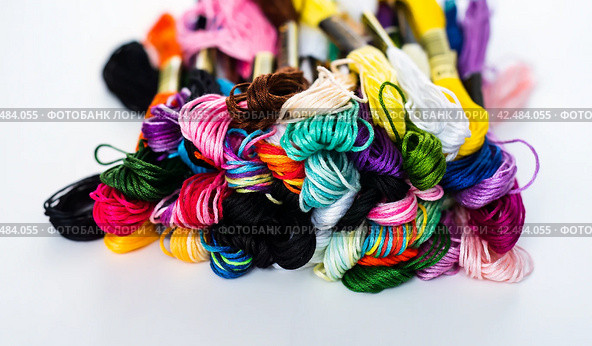 Many skeins of mouline thread for embroidery on a row in circle on black background. Стоковое фото, фотограф Татьяна Терехина / Фотобанк Лори
