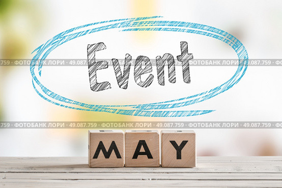 May event sign on a wooden table with text. Стоковое фото, агентство Ingram Publishing / Фотобанк Лори