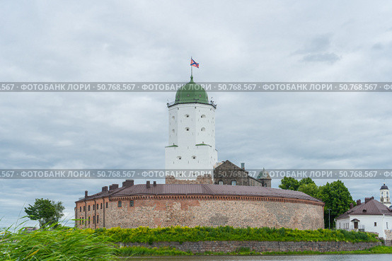 Medieval castle in Vyborg and St. Olav Tower. Редакционное фото, фотограф Мария Паина / Фотобанк Лори