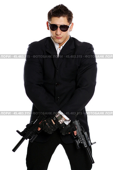 Men in black suit holding gun. Стоковое фото, фотограф Андрей Аркуша / Фотобанк Лори
