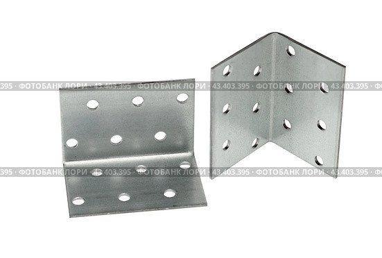 Металлический крепежный угольник на белом фоне. Metallic angle fixator on white background. Стоковое фото, фотограф Татьяна Д / Фотобанк Лори