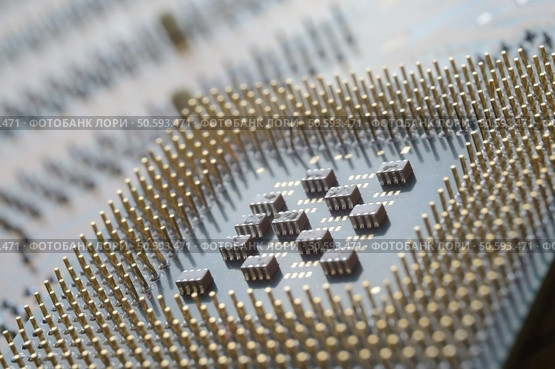microprocessor from the computer lies on the motherboard. close-up. Стоковое фото, агентство Ingram Publishing / Фотобанк Лори
