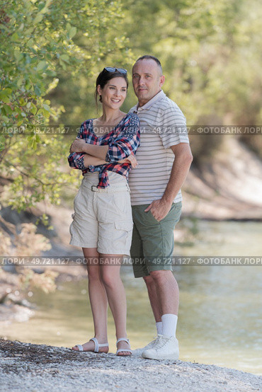 middle aged couple stood on river bank. Стоковое фото, агентство Ingram Publishing / Фотобанк Лори