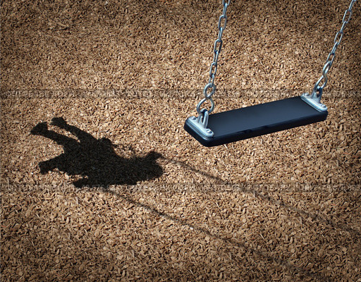 Missing child concept with an empty playground swing and the shadow of a little girl on the park floor as a symbol of children losing their childhood and being lost as in a failed adoption or youth despair caused by family violence. Стоковое фото, агентство Ingram Publishing / Фотобанк Лори