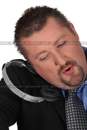 moon-faced man losing headphones. Стоковое фото, агентство Ingram Publishing / Фотобанк Лори