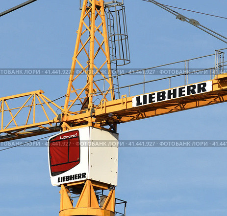 Moscow, Russia - Oct 11.2023. Cabin and part of the liebherr crane boom. Редакционное фото, фотограф Володина Ольга / Фотобанк Лори