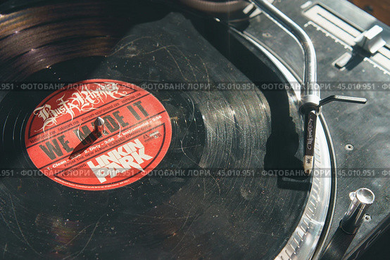 Moscow, Russia - September 13 2019: Photography of modern vinyl turntable with vinyl plate. Listen to music. Close view from above. Редакционное фото, фотограф YuryKara / Фотобанк Лори