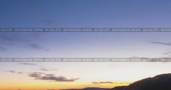 Mountain lake time lapse in summer or autumn. Wild nature and beautiful sunset. Moving clouds, deep twilight and dramatic sky. Стоковое видео, видеограф Александр Маркин / Фотобанк Лори